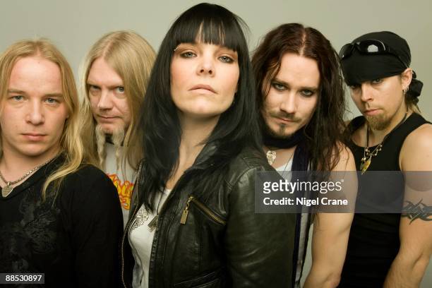 Posed studio group portrait of Finnish metal band Nightwish. Left to right are Emppu Vuorinen, Marco Hietala, Anette Olzon, Tuomas Holopainen and...