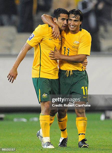 Tim Cahill of Australia celebrates his goal with team mate Nick Carle during the 2010 FIFA World Cup Asian qualifying match between the Australian...
