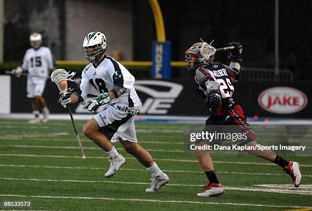 Stephen Peyser of the Long Island Lizards controls the ball during a Major League Lacrosse game as Sean Morris of the Boston Cannons tries to defend...