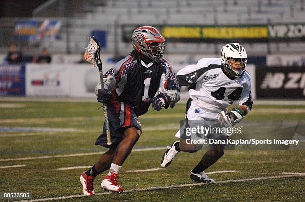 John Christmas of the Boston Cannons controls the ball as Matt Zash of the Long Island Lizards defends during a Major League Lacrosse game at Shuart...