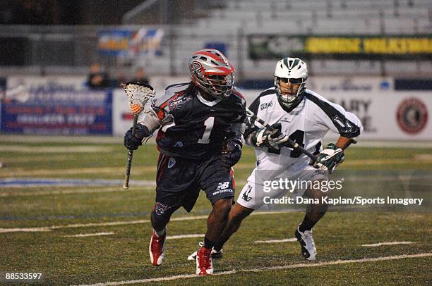 John Christmas of the Boston Cannons controls the ball as Matt Zash of the Long Island Lizards defends during a Major League Lacrosse game at Shuart...
