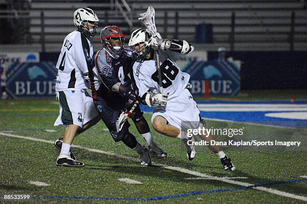Zach Greer of the Long Island Lizards controls the ball as Bobby Horsey of the Boston Cannons defends during a Major League Lacrosse game at Shuart...