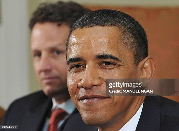 President Barack Obama, with US Treasury Secretary Timothy F. Geithner, meets with regulators June 17, 2009 in the Roosevelt Room of the White House...