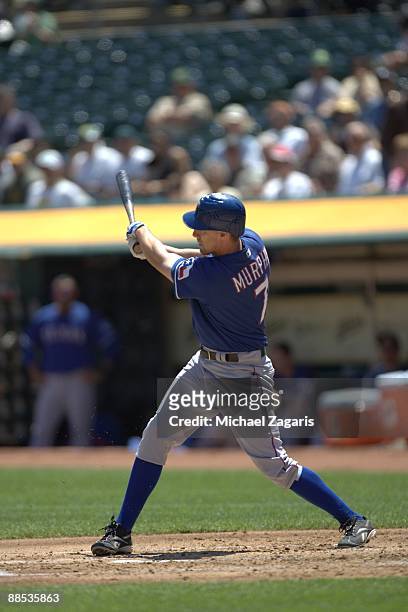 David Murphy of the Texas Rangers swings at a pitch during the game against the Oakland Athletics at the Oakland Coliseum on May 7, 2009 in Oakland,...