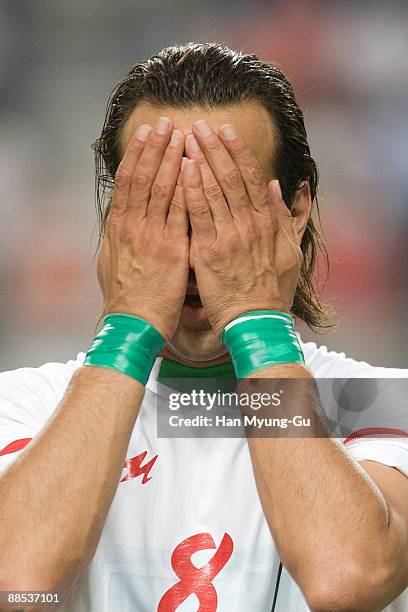 Karimi Mohammad Ali of Iran wears symbolic green wrist bands before the 2010 FIFA World Cup Asian Qualifiers match between Iran and South Korea at...