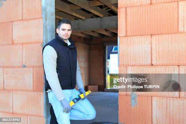 france, young working person in a house in construction. - general director stock pictures, royalty-free photos & images