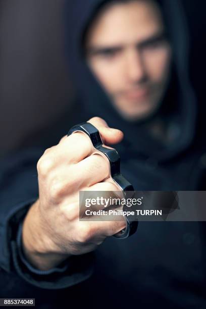 france, young man with brass knuckles - knuckle duster imagens e fotografias de stock