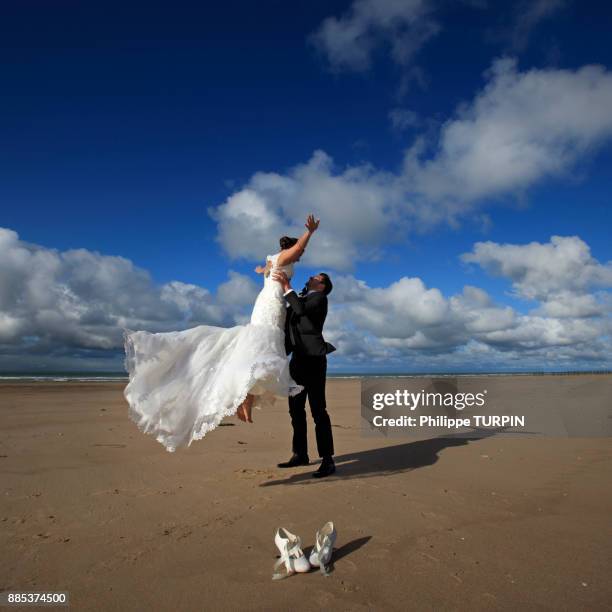 france, couple of married on the beach. - carrying bride stock pictures, royalty-free photos & images