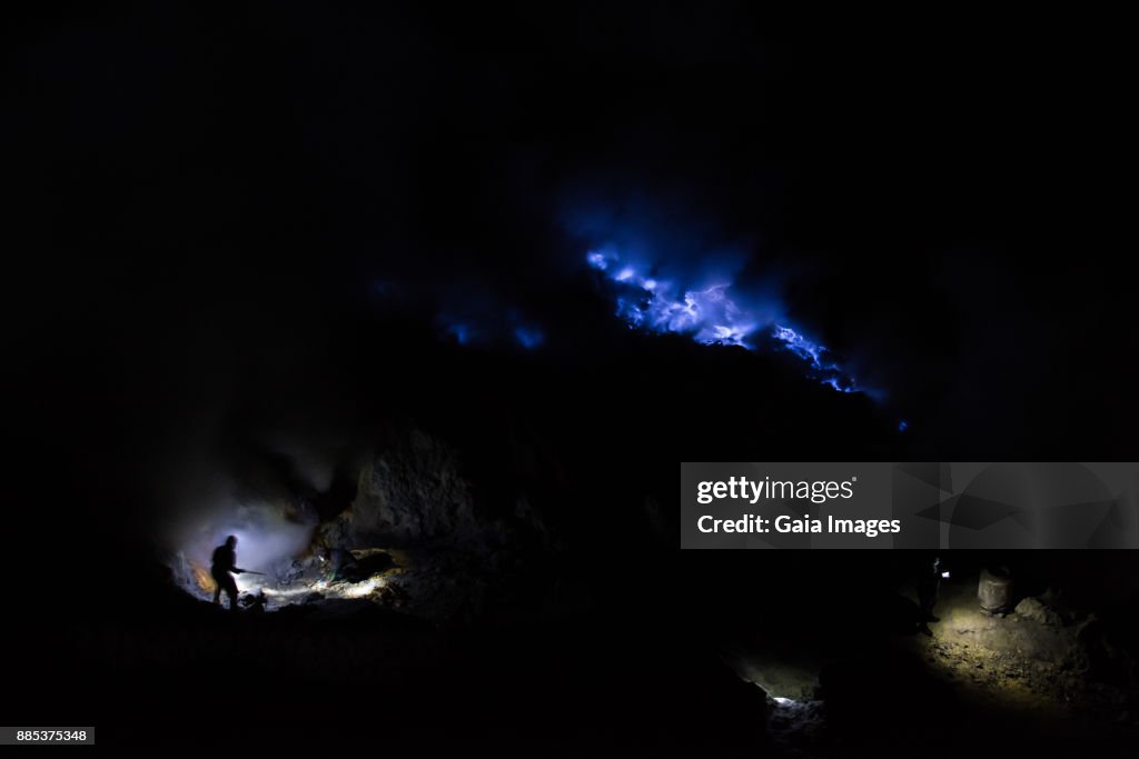 Indonesia, Java, Kawah Ijen volcano crater, sulphur miners.