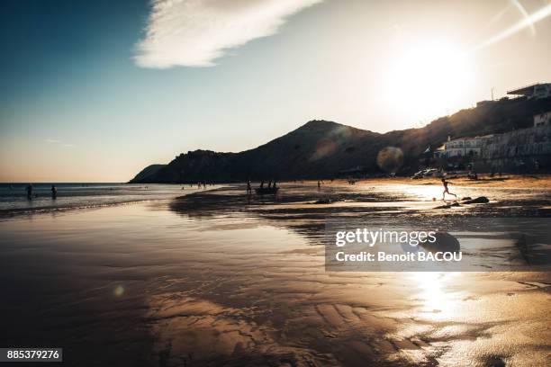 sunset on the beach of burgau, algarve region, portugal - burgau portugal stock pictures, royalty-free photos & images