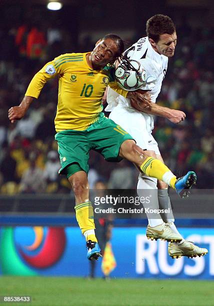 Steven Pienaar of South Africa and Tim Brown of New Zealand go up for a header during the FIFA Confederations Cup match between South Africa and New...