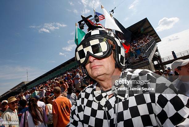 Race fan watches the action during Miller Lite Carb Day practice for the IRL IndyCar Series 93rd running of the Indianapolis 500 on May 22, 2009 at...