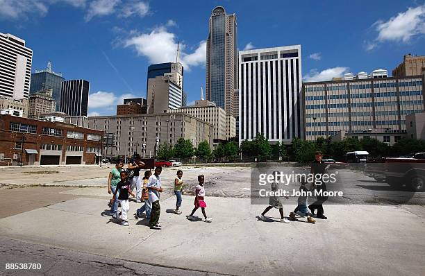 Homeless children are led to lunch at a soup kitchen on June 17, 2009 in Dallas, Texas. The National Center on Family Homelessness reported this year...