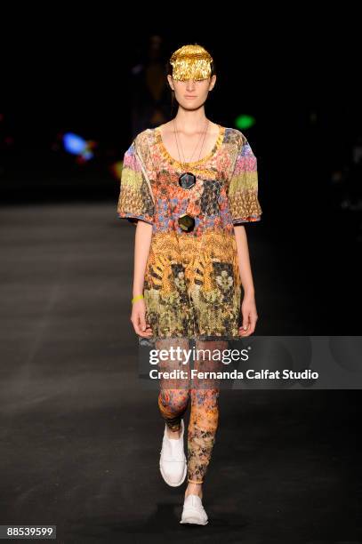 Model displays a design by Osklen during the first day of the Sao Paulo Fashion Week Spring-Summer 2010 collection at the Bienal Pavilion in...