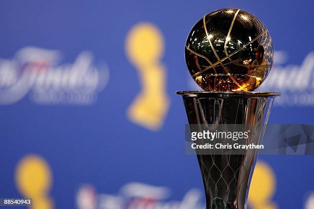 The Bill Russell MVP trophy is shown as Kobe Bryant of the Los Angeles Lakers speaks to the media after the Lakers defeated the Orlando Magic in Game...