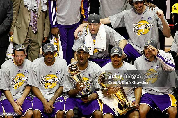 Jordan Farmar, Trevor Ariza, Kobe Bryant, Luke Walton, Derek Fisher, Pau Gasol and Sasha Vujacic of the Los Angeles Lakers pose together after...