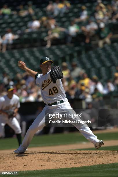 Michael Wuertz of the Oakland Athletics pitches during the game against the Toronto Blue Jays at the Oakland Coliseum on May 10, 2009 in Oakland,...
