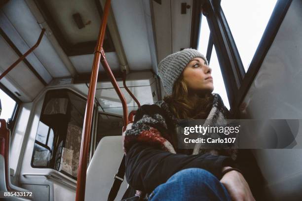 young sad woman on a bus - rainy season stock pictures, royalty-free photos & images