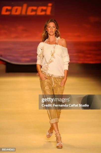 Gisele Bundchen displays a design by Colcci during the first day of Sao Paulo Fashion Week Spring-Summer 2010 collection at the Bienal Pavilion in...