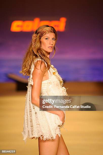 Gisele Bundchen displays a design by Colcci during the first day of Sao Paulo Fashion Week Spring-Summer 2010 collection at the Bienal Pavilion in...