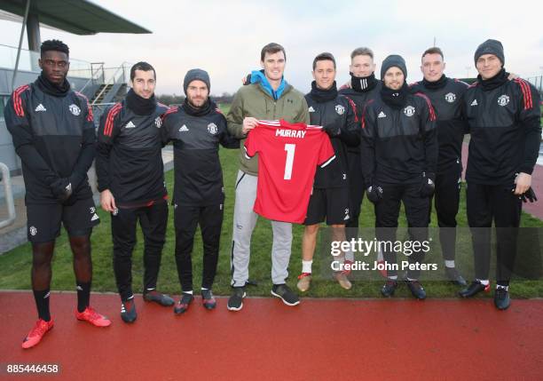 Axel Tuanzebe, Henrikh Mkhitaryan, Juan Mata, Ander Herrera, Scott McTominay, Daley Blind, Phil Jones and Victor Lindelof of Manchester United pose...