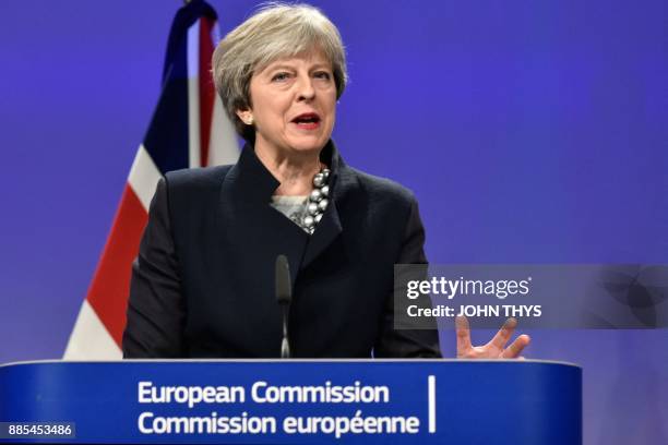 British Prime Minister Theresa May gives a speech as she attends a Brexit negotiations meeting on December 4, 2017 at the European Commission in...