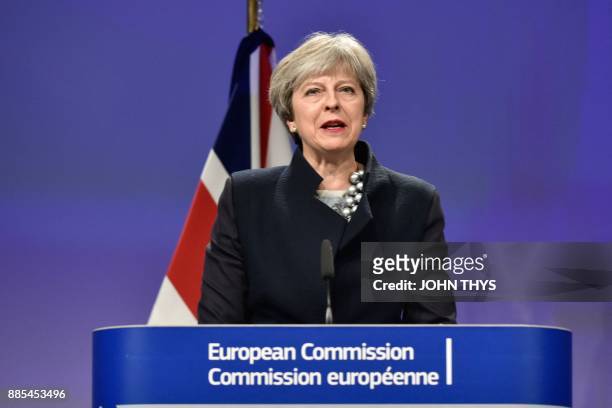 British Prime Minister Theresa May gives a speech as she attends a Brexit negotiations meeting on December 4, 2017 at the European Commission in...