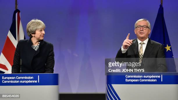 British Prime Minister Theresa May and European Commission chief Jean-Claude Juncker give a press conference as they meet for Brexit negotiations on...