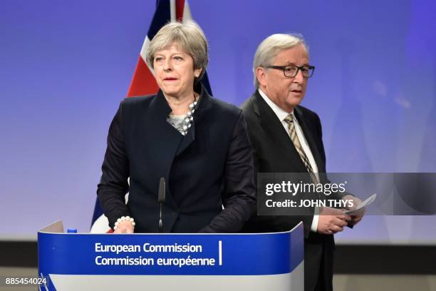 British Prime Minister Theresa May and European Commission chief Jean-Claude Juncker give a press conference as they meet for Brexit negotiations on...