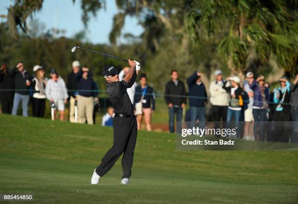 Austin Cook plays a shot on the 18th green during the final round of The RSM Classic at the Sea Island Resort Seaside Course on November 19, 2017 in...