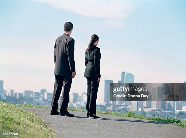 colleagues on path looking out towards seattle , washington - donna elegante stock-fotos und bilder