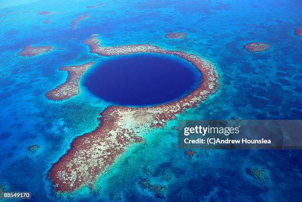 belize - blue hole from the air - lighthouse reef stock pictures, royalty-free photos & images