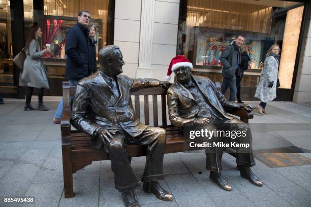 Winston Churchill wearing a Santa hat on the statue called Allies by sculpter Lawrence Holofcener of President Roosevelt and Winston Churchill on...