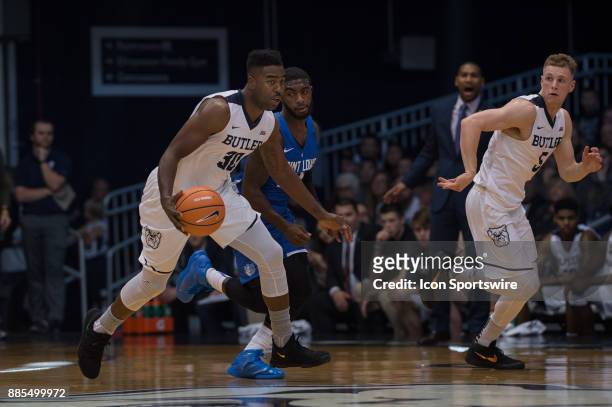 Butler Bulldogs forward Kelan Martin brings the ball up the court on a fast break during the men's college basketball game between the Butler...