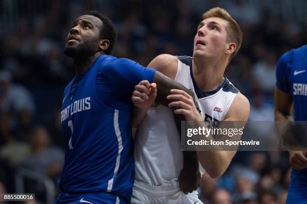 Saint Louis Billikens forward D.J. Foreman blocks out Butler Bulldogs forward Joey Brunk during the men's college basketball game between the Butler...