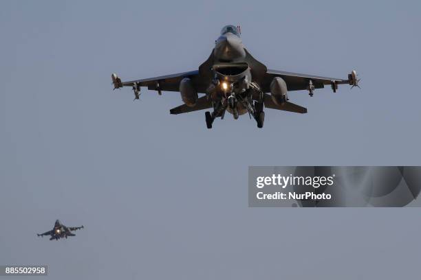 Dec 04, 2017-Osan, South Korea-United States Airforce F-16 landing on the runway at Osan Military Airbase in Pyeongtaek, South Korea. South Korea and...