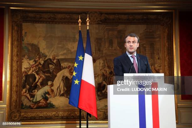 French president Emmanuel Macron gives a speech during a ceremony in tribute to Evelyne Richard who retires from the Elysee palace press office after...