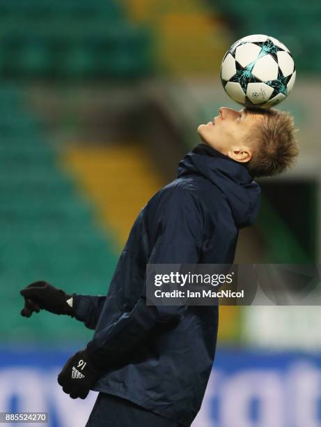 Lukasz Teodorczyk balances a ball on his head during an Anderlecht training session on the eve of their UEFA Champions League match against Celtic at...