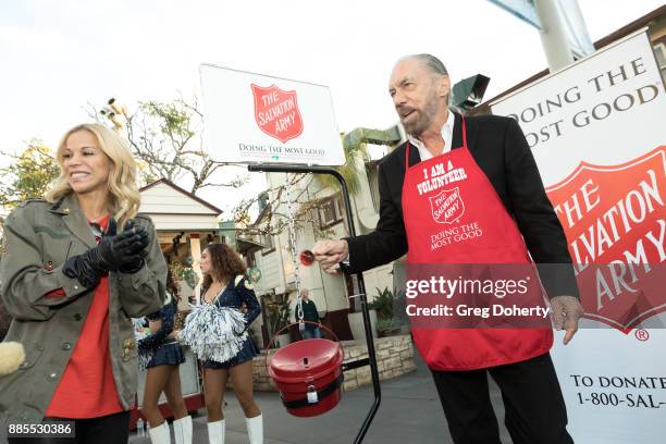 Entrepreneur / Philanthropist John Paul Dejoria and wife Eloise Broady donate money at The Salvation Army Celebrity Kettle Kickoff - Red Kettle...