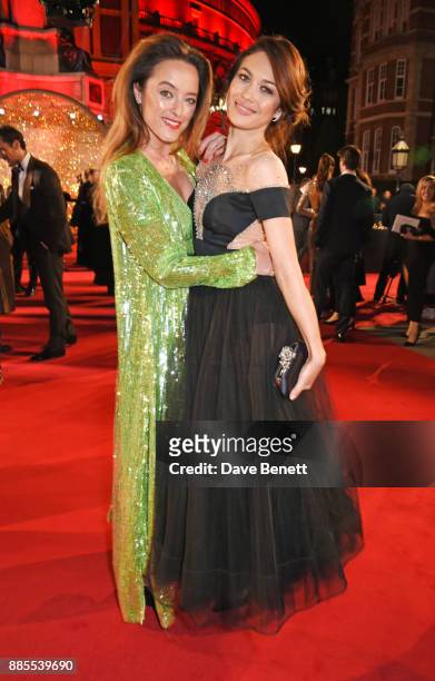 Alice Temperley and Olga Kurylenko attend The Fashion Awards 2017 in partnership with Swarovski at Royal Albert Hall on December 4, 2017 in London,...