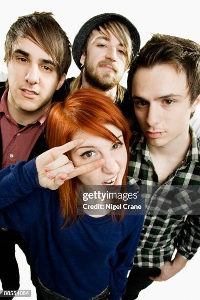 Posed studio group portrait of American rock band Paramore. Left to right are Zac Farro, Hayley Williams , Jeremy Davis and Josh Farro in London on...