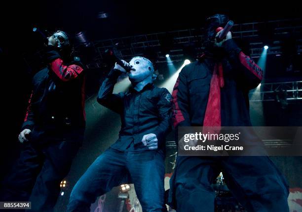 Chris Fehn, Corey Taylor and Shawn "Clown" Crahan of American metal band Slipknot perform on stage at the Cardiff International Arena in Cardiff,...