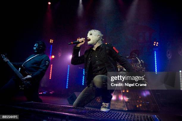 Chris Fehn and Corey Taylor of American metal band Slipknot perform on stage at the Hammersmith Apollo in London on December 2 2008.