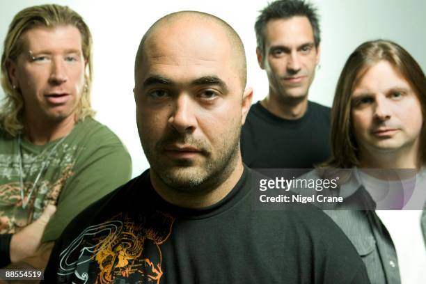 Posed studio group portrait of American rock band Staind. Left to right are Jon Wysocki, Aaron Lewis, Johnny April and Mike Mushok in New York on...