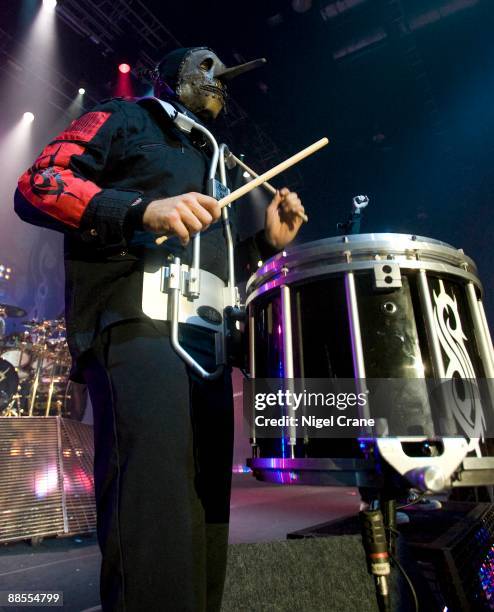 Chris Fehn percussionist of American metal band Slipknot performs on stage at the Cardiff International Arena in Cardiff, Wales on December 05 2008.