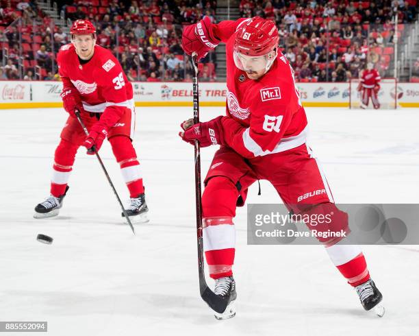 Xavier Ouellet of the Detroit Red Wings shoots the puck against the Montreal Canadiens during an NHL game at Little Caesars Arena on November 30,...