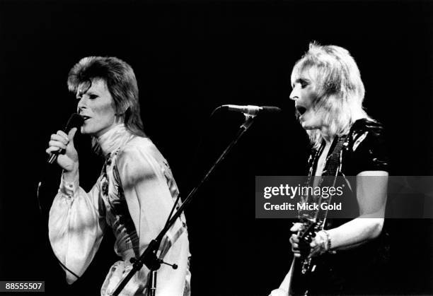 David Bowie and Mick Ronson perform on stage during the Ziggy Stardust and the Spiders from Mars tour at Earls Court, London on May 12 1973.