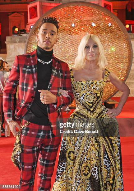 Lewis Hamilton and Donatella Versace attend The Fashion Awards 2017 in partnership with Swarovski at Royal Albert Hall on December 4, 2017 in London,...
