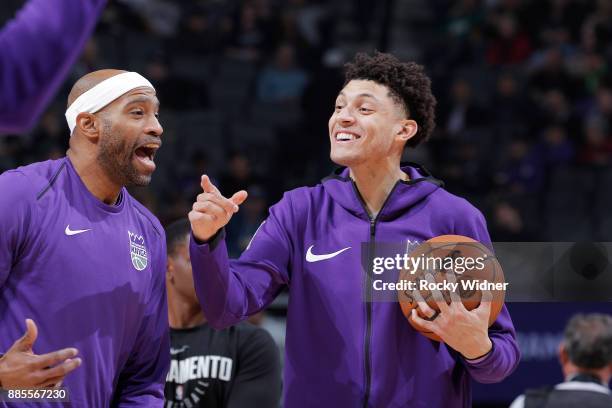Vince Carter and Justin Jackson of the Sacramento Kings talk prior to the game against the Milwaukee Bucks on November 28, 2017 at Golden 1 Center in...