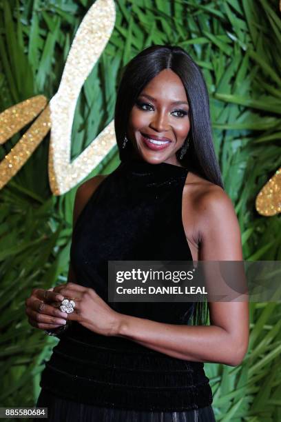 English model Naomi Campbell poses on the red carpet upon arrival to attend the British Fashion Awards 2017 in London on December 4, 2017.